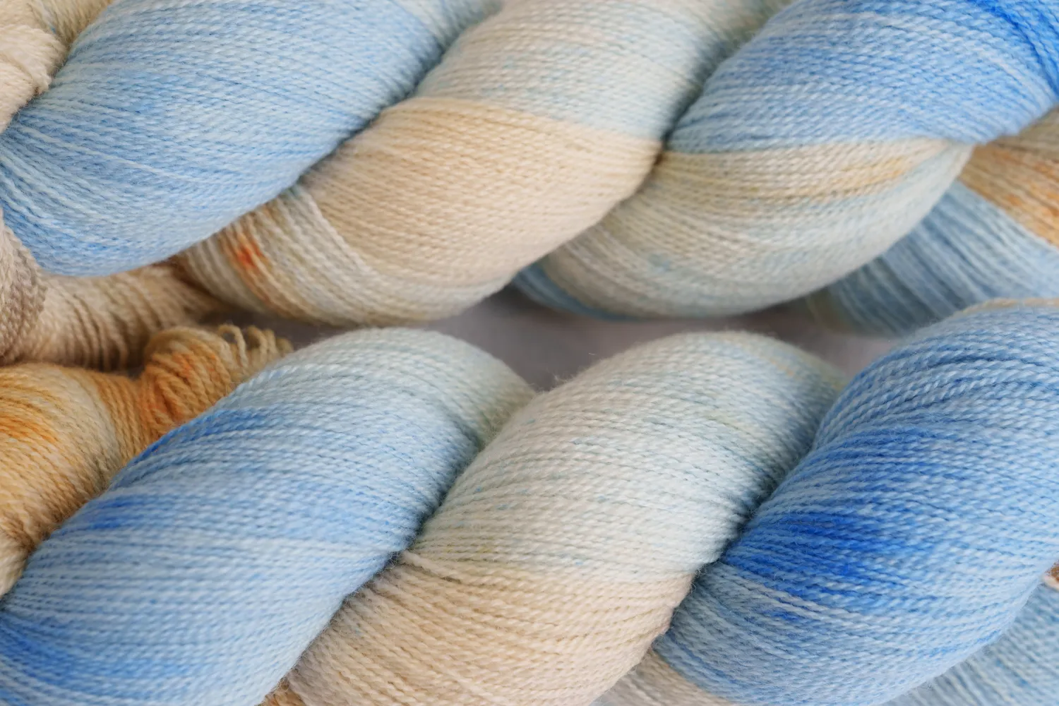Skeins in pale blue and cream